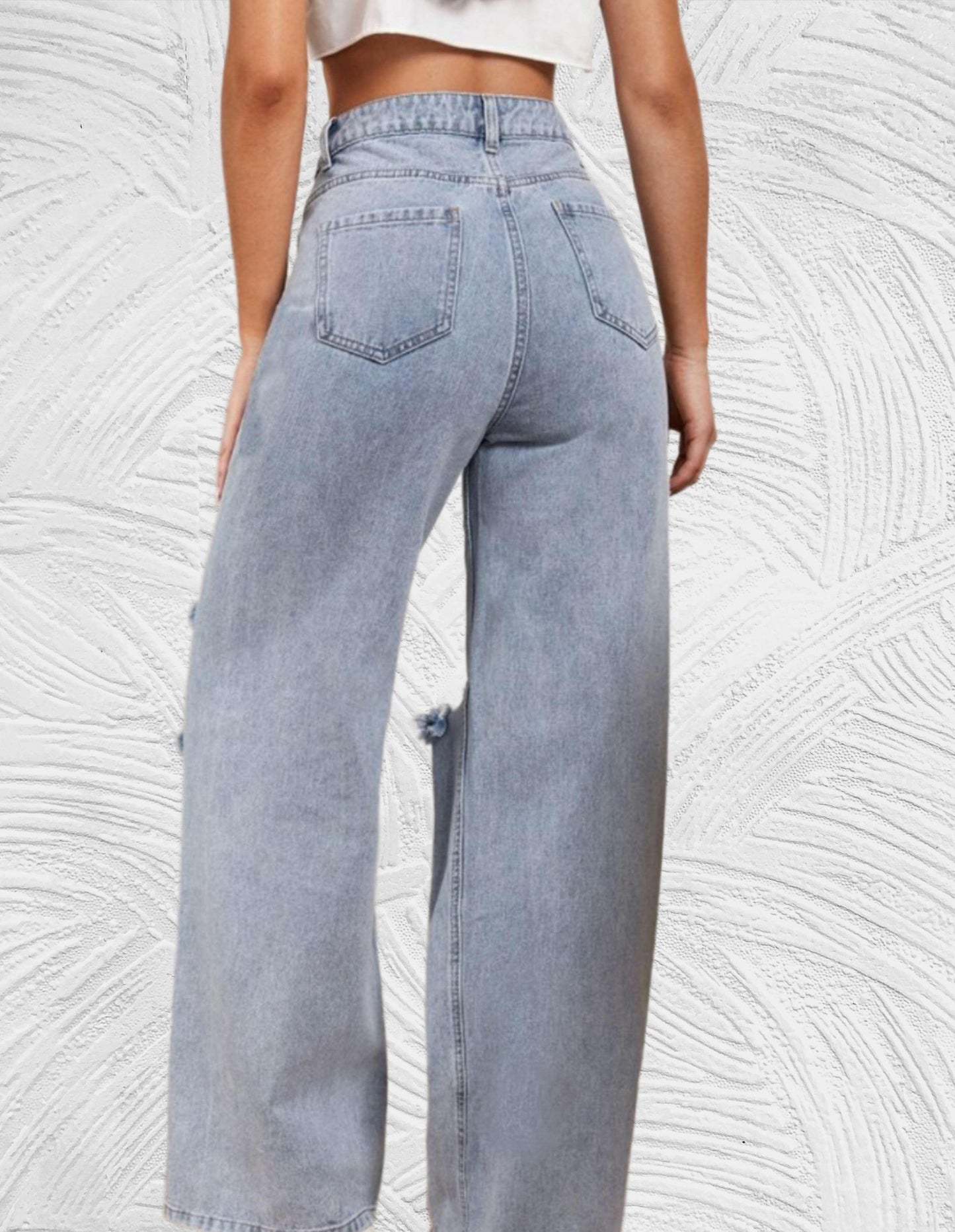 Losse jeans met hoge taille en gescheurd ontwerp